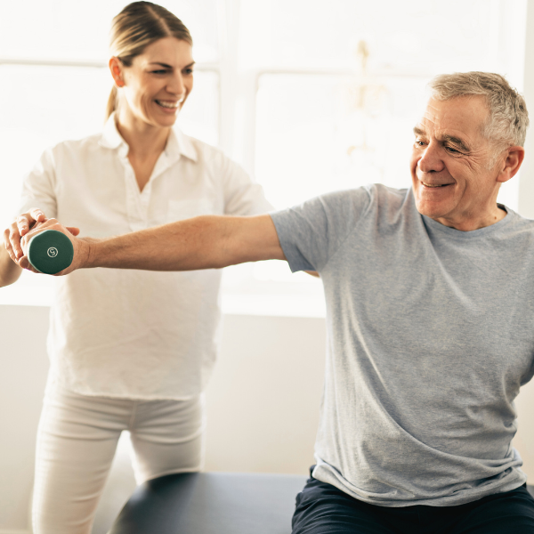 Man lifting a weight to check shoulder strength during a physiotherapy session